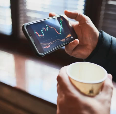Person investing trading on stock cryptocurrency market using investing application on smartphone